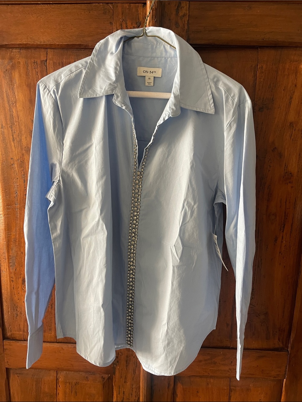on 34 th Light Blue Long Sleeve Blouse with rhinestone Trim